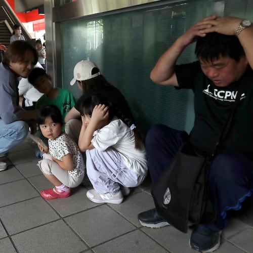 People take cover inside at a MRT station during the Urban Resilience (Air-Defense) Exercise, part of the annual Han Kuang military exercises in Taipei, Taiwan, Thursday, Aug. 13, 2026. (AP Photo/Chiang Ying-ying)