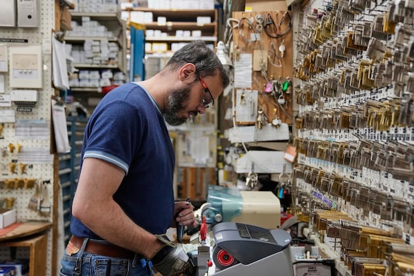 Employee Jon Vazquez-DeAnda cuts keys for a customer at employee-owned Devon Hardware, Wednesday, April 2, 2025, in Chicago. (AP Photo/Erin Hooley)