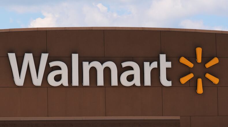 The Walmart logo is displayed on a store, Aug. 14, 2025, in Manchester, N.H. (AP Photo/Charles Krupa, File)