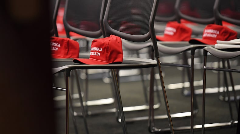 "Make America great again" hats await attendees at a Republican event at the Capitol. As President-elect Donald Trump plans his transition to power, he appears to be increasingly uncomfortable with outsiders and suspicious of the "bicoastal elite," in the words of an insider.