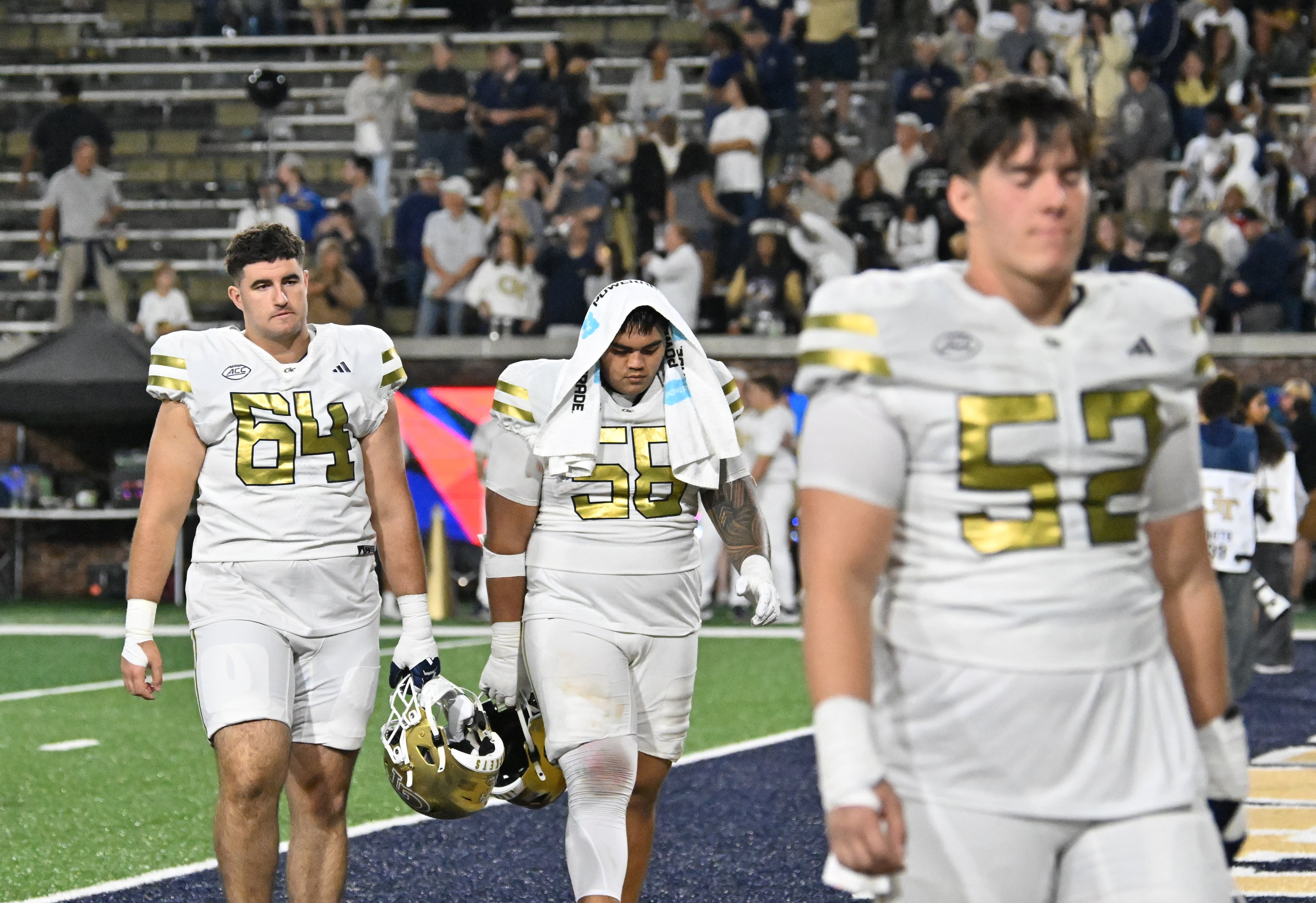 Georgia Tech players leave the field after Pittsburgh beat Georgia Tech during an NCAA college football game at Bobby Dodd Stadium, Saturday, November 22, 2025 in Atlanta. Pittsburgh won 42-28 over Georgia Tech. (Hyosub Shin / AJC)
