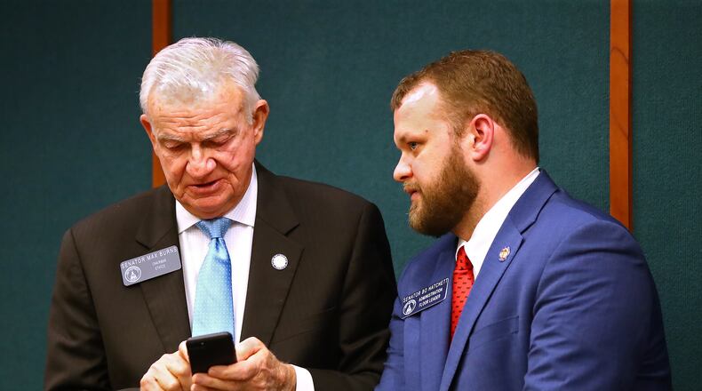 State Sen. Max Burns (left), chairman of the Senate Ethics Committee, has proposed legislation that would make the printed words on ballots the official vote instead of bar codes that are used now but are unreadable by the human eye. CURTIS COMPTON