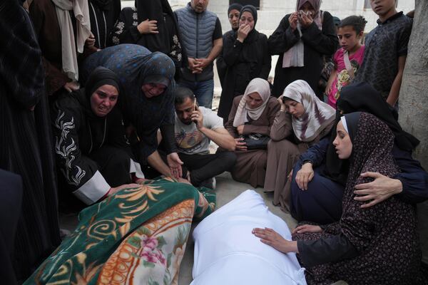 Palestinians bid farewell to their relatives who were killed in Israeli airstrikes early this morning on Yaffa School, in Gaza City, Wednesday, April 23, 2025. (AP Photo/Jehad Alshrafi)