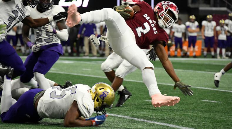 Warner Robins' Marcayll Jones is upended by Bainbridge DE Tahari Tate during their class 5A high school championship football game, Tuesday, Dec., 11, 2018, at Mercedes-Benz Stadium, in Atlanta. (John Amis/Special)