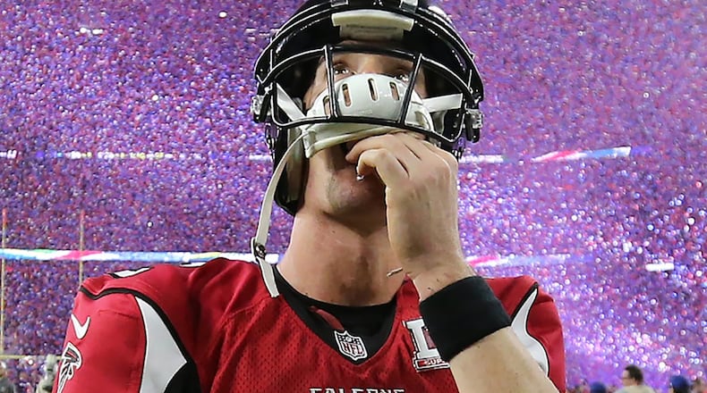 Falcons quarterback Matt Ryan reacts to losing the Super Bowl as the screen above the NRG Stadium field shows Patriots quarterback Tom Brady and the confetti flies on Sunday Feb. 5, 2017, in Houston. (Curtis Compton/ccompton@ajc.com)