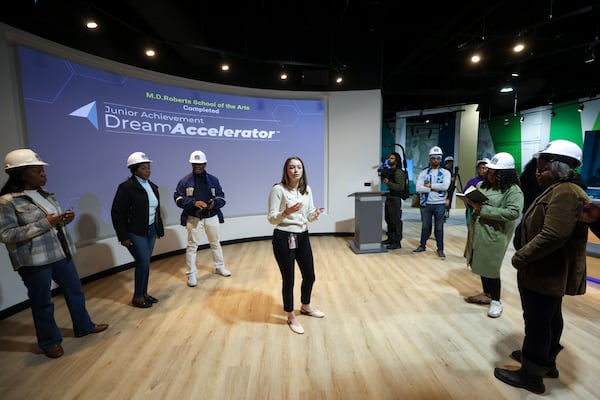 Sydney Thomas, with the Junior Achievement Delta Discovery Center, gives a tour of the Junior Achievement Delta Dream Accelerator at the multipurpose Arena at Southlake in Morrow. (Jason Getz/AJC)