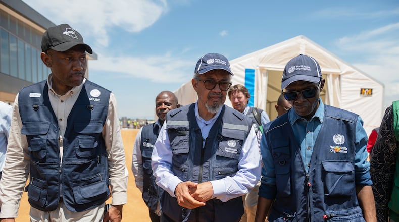Director General of the World Health Organisation (WHO), Tedros Adhanom Ghebreyesus, center, arrives in Bunia, Congo, Saturday, May 30, 2026. (AP Photo/Moses Sawasawa)