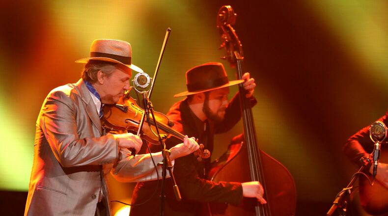 Mark O'Connor, left, and The O'Connor band perform at the 59th annual Grammy Awards on Sunday, Feb. 12, 2017, in Los Angeles. (Photo by Matt Sayles/Invision/AP)