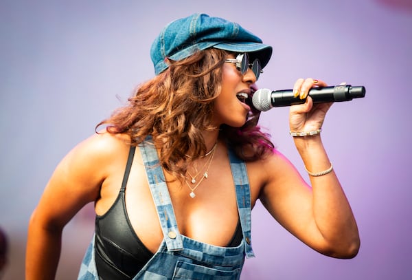 R&B singer Keri Hilson, shown singing her hits during the DJ Mars R&B Block Party on Oct. 27, 2024, at Central Park. (Ryan Fleisher for The Atlanta Journal-Constitution)