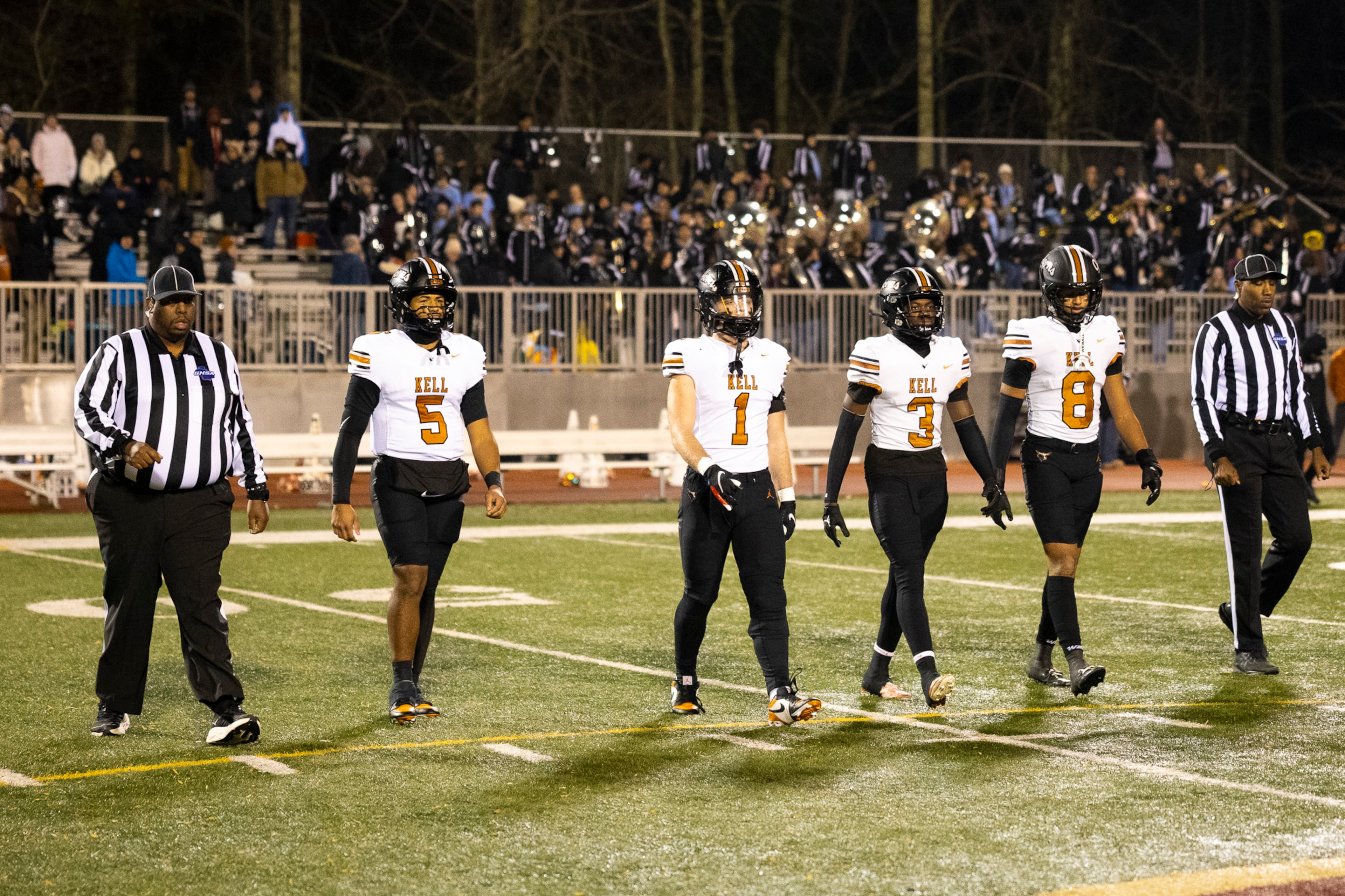 Kell captains come up to the center circle before the game in the class 4A semifinal against Creekside at Creekside High School in Fairburn, GA on Friday, December 5, 2025. (Oscar Guevara Saenz for the AJC)