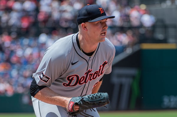 Detroit Tigers starting pitcher Tarik Skubal reacts after missing a tag against Cleveland Guardians' Steven Kwan at first base during the fourth inning of a baseball game, Sunday, July 6, 2025, in Cleveland. (AP Photo/Phil Long)
