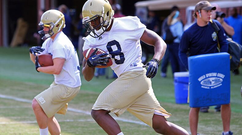 Originally signed as part of the 2013 class, Tavis Custis (8) showed signs of being a potential star at the B-back spot with his strength and speed combination.