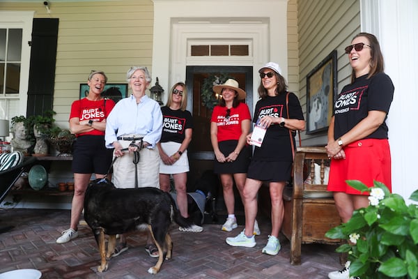 Campaign volunteers for Republican Gubernatorial Candidate Burt Jones stand with Tyler Garland on her porch in Jones’ hometown, Jackson, on Saturday, June 6, 2026. (Abbey Cutrer/AJC)