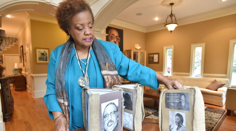 Elisabeth Williams-Omilami, daughter of Hosea Williams, shows photographs of her late father at her home on Nov. 30, 2016. HYOSUB SHIN / HSHIN@AJC.COM