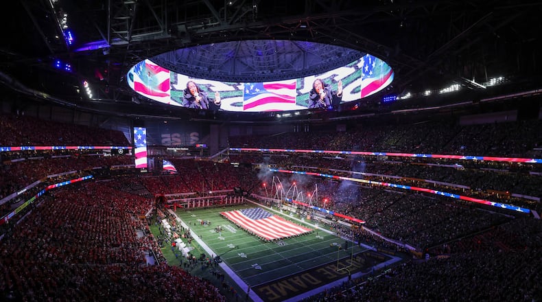 Fireworks go off during the national anthem before the 2025 College Football Playoff national championship game between Ohio State and Notre Dame at Mercedes-Benz Stadium on Monday, Jan. 20, 2025, in Atlanta. (Jason Getz/AJC)