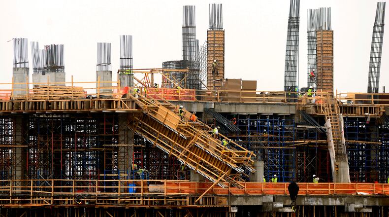 Fog surrounds constructions workers building the new Atlanta Falcons stadium Monday, March 2, 2015, in Atlanta. Forecasters predicted daytime highs reaching the low 50's before a possibility of showers move in for the evening hours. David Tulis/AJC Special Workers continue construction of the new Falcons stadium, March 2015. (Photo: David Tulis)