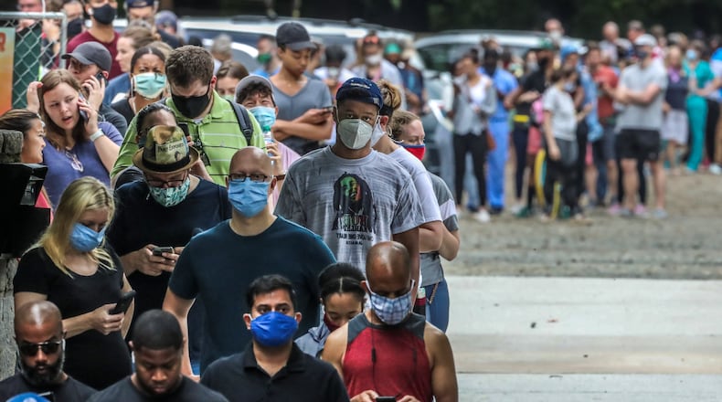 June 9, 2020 Atlanta: Voters had a long wait (some 2-3 hours) at the Park Tavern polling place located at 500 10th St NE, on Tuesday, June 9, 2020 in Atlanta. Many voters said they requested absentee ballots but never received them. Two lines, 300-yards long each formed parallel to Piedmont park in the parking lot as people patiently waited to vote. Over 1.2 million people had already voted before the polls opened on Tuesday, three-quarters of them with absentee-by-mail ballots, allowing them to avoid human contact at the polls. Voters will decide on many candidates, from president to county sheriff. The ballot also includes races for U.S. Senate, U.S. House and the Georgia General Assembly. JOHN SPINK/JSPINK@AJC.COM