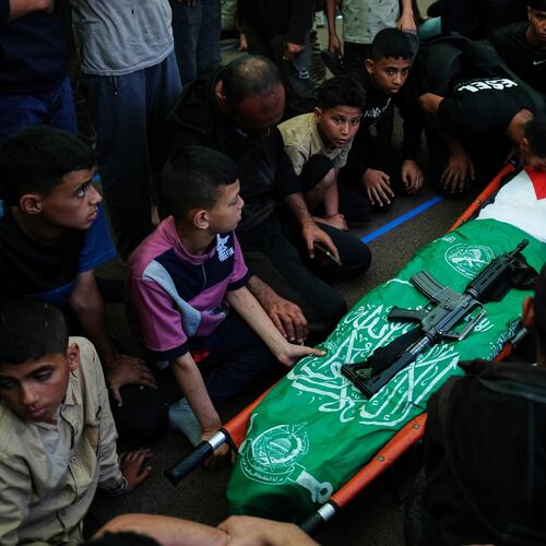 Palestinians mourn over the body of Hamas militant Imad al-Salem, who was killed in an Israeli military strike, during his funeral at Al-Shafi'i Mosque in Gaza City, Thursday, May 28, 2026. (AP Photo/Jehad Alshrafi)