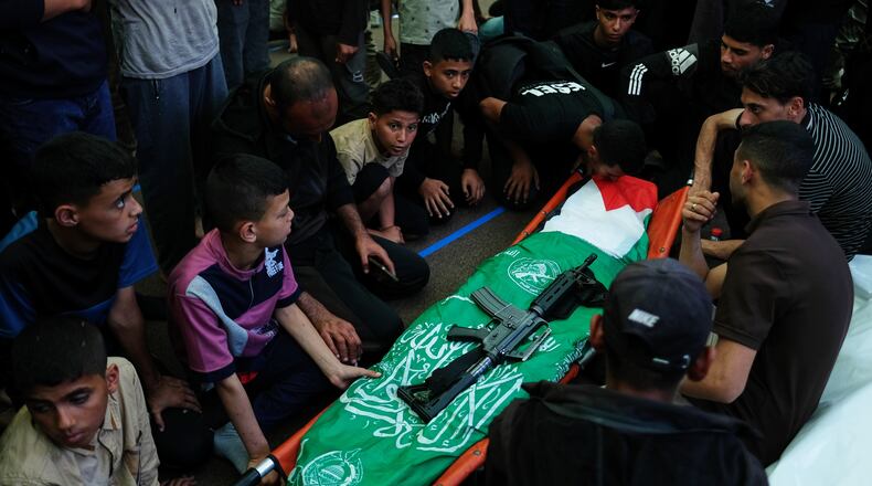Palestinians mourn over the body of Hamas militant Imad al-Salem, who was killed in an Israeli military strike, during his funeral at Al-Shafi'i Mosque in Gaza City, Thursday, May 28, 2026. (AP Photo/Jehad Alshrafi)
