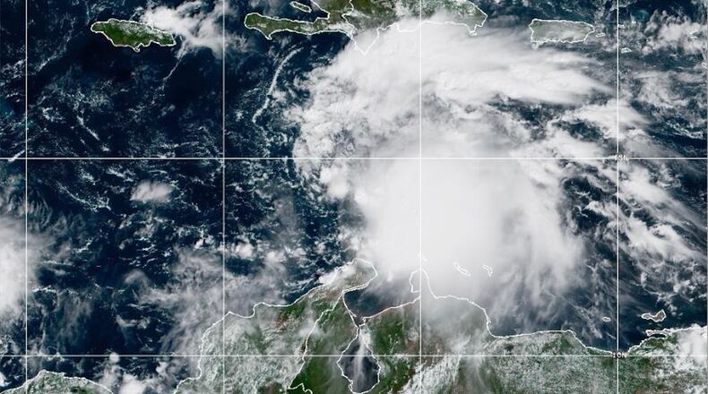 This NOAA satellite image taken at 11:40 a.m. EST on Tuesday, Oct. 21, 2025, shows Tropical Storm Melissa in the Central Caribbean Sea. (NOAA via AP)