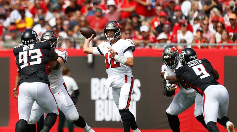 Tampa Bay Buccaneers quarterback Tom Brady (12) throws a pass to a receiver, while being pressured by the Atlanta Falcons during the second quarter at Raymond James Stadium in Tampa, Florida, on Sunday, Oct. 9, 2022. (Jefferee Woo/Tampa Bay Times/TNS)
