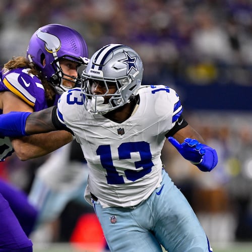 FILE - Dallas Cowboys defensive end Dante Fowler Jr. (13) rushes the line past Minnesota Vikings tight end T.J. Hockenson (87) during an NFL football game between the Dallas Cowboys and the Minnesota Vikings on Dec. 14, 2025, in Arlington, Texas. (AP Photo/Jerome Miron, File)