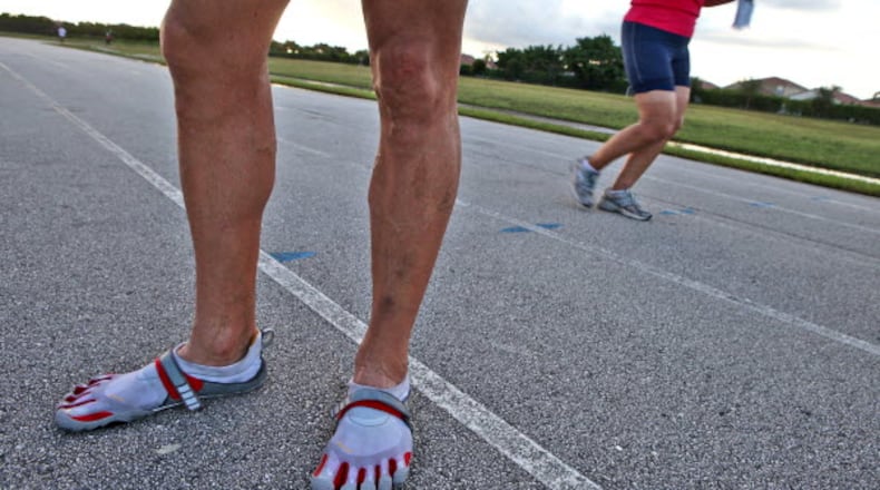 Richard Wygand wears his five fingered shoes before a cooldown with the RW Training running club at Polo Park Middle School on August 4, 2010. Wygand wears the shoes during his cool down to strengthen his feet and legs, which helps reduce the chance of injury.