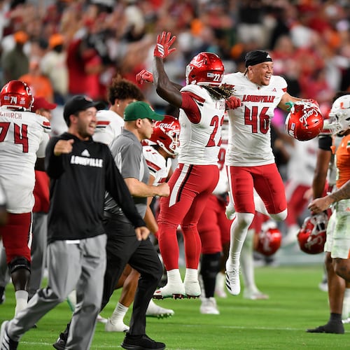 FILE - Louisville players celebrate beating Miami in an NCAA college football game, Oct. 17, 2025, in Miami Gardens, Fla. (AP Photo/Michael Laughlin, File)