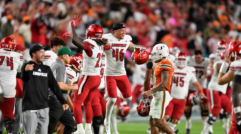 FILE - Louisville players celebrate beating Miami in an NCAA college football game, Oct. 17, 2025, in Miami Gardens, Fla. (AP Photo/Michael Laughlin, File)
