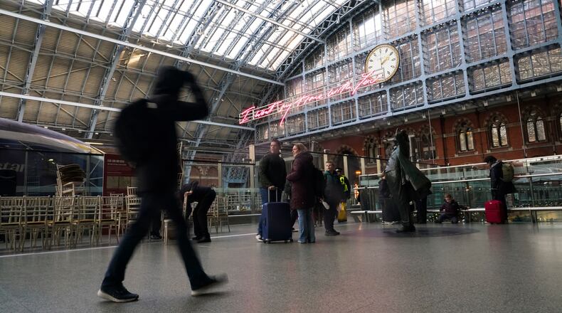 Travellers wait for Eurostar services at St Pancras International station in London, Tuesday, Dec. 30, 2025. (AP Photo/Alberto Pezzali)
