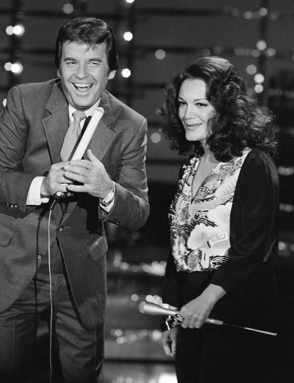 FILE - In this Dec. 9, 1980 file photo, Dick Clark, host of American Bandstand, left, appears with Connie Francis during taping of the show in Los Angeles. (AP Photo/Reed Saxon, File)