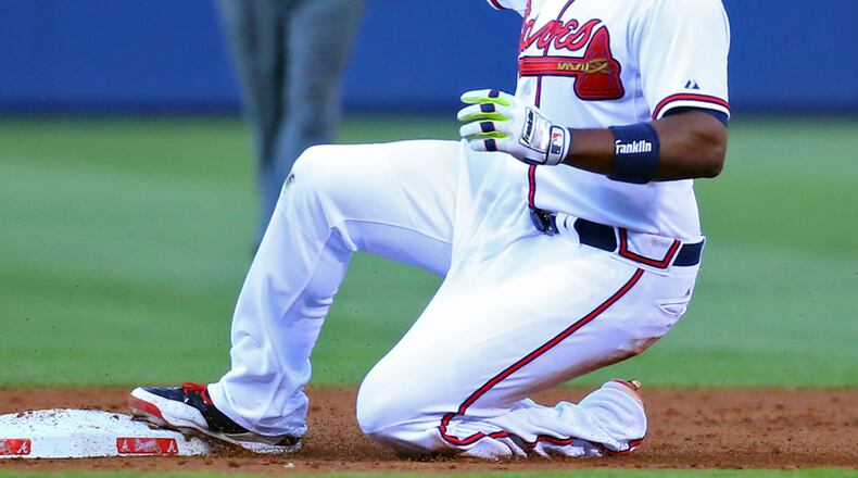 Justin Upton beats the throw to second for a double against the Cardinals during the first inning of a MLB game on Wednesday, May 7, 2014, in Atlanta. CURTIS COMPTON / CCOMPTON@AJC.COM