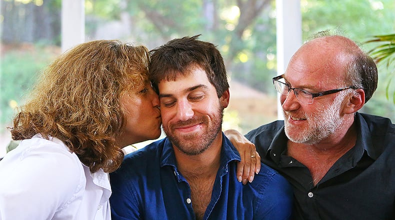 060715 Johns Creek: Jeff and Jeanne Schultz with their son Josh on the porch of the family home on Sunday, June 7, 2015, in Johns Creek. Four years ago Josh Schultz, on the verge of graduating from the University of Georgia, entered a treatment program for an addiction to opiates. His struggles in recovery, which included multiple relapses and thoughts he might not survive, were painful for all involved. But through it all, the concept of addiction as a family disease became clear and Jeff and Jeanne Schultz started working thier own recovery program parallel to Josh’s. Curtis Compton / ccompton@ajc.com