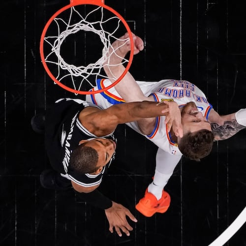 Oklahoma City Thunder center Isaiah Hartenstein (55) shoots against San Antonio Spurs forward Victor Wembanyama (1) in the second half of Game 6 in the Western Conference finals NBA basketball playoffs series, Thursday, May 28, 2026, in San Antonio. (AP Photo/David J. Phillip)