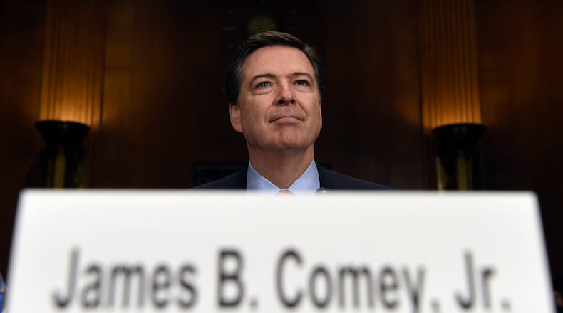 FBI Director James Comey prepares to testify on Capitol Hill in Washington in this 2015 file photo. AP Photo/Susan Walsh