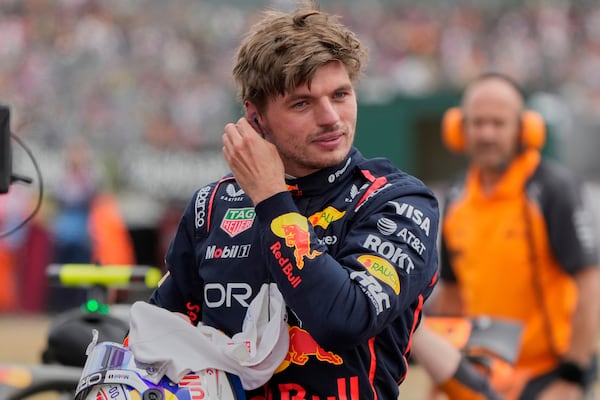 Red Bull driver Max Verstappen of the Netherlands reacts after taking the pole position during the qualifying for the British Formula One Grand Prix in Silverstone, England, Saturday, July 5, 2025. (AP Photo/Darko Bandic)
