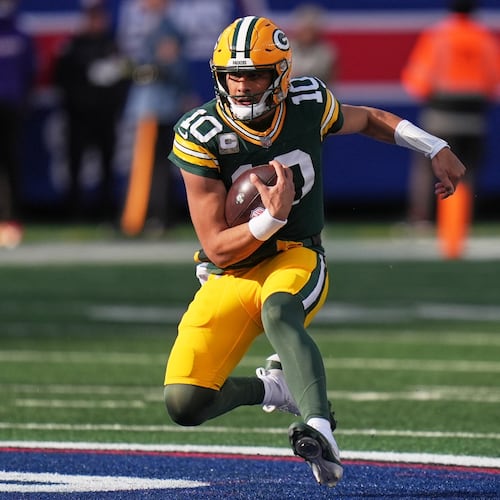 Green Bay Packers' Jordan Love runs during the first half of an NFL football game against the New York Giants Sunday, Nov. 16, 2025, in East Rutherford, N.J. (AP Photo/Seth Wenig)