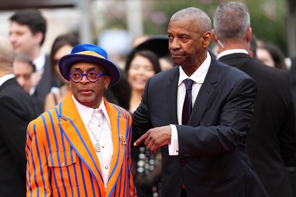 Director Spike Lee, left, and Denzel Washington pose for photographers upon arrival at the premiere of the film 'Highest 2 Lowest' at the 78th international film festival, Cannes, southern France, Monday, May 19, 2025. (Photo by Scott A Garfitt/Invision/AP)