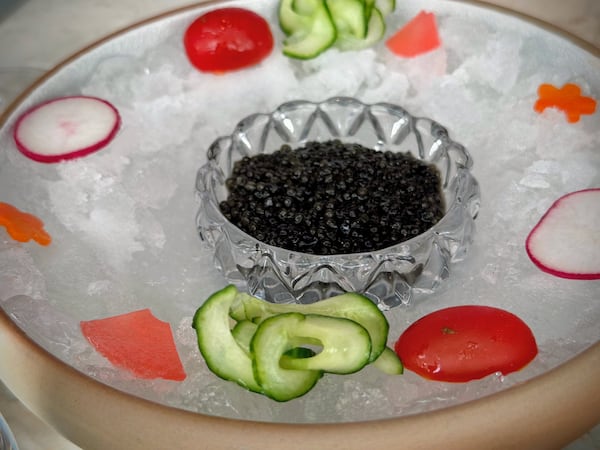 The caviar service at Brush Sushi in Buckhead is served with rice and nori, so it can be made into sushi hand rolls. (Henri Hollis/AJC)