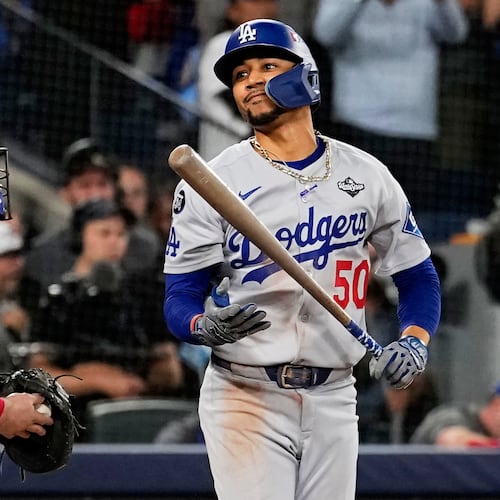 Los Angeles Dodgers' Mookie Betts reacts after striking out against the Toronto Blue Jays to end Game 1 of baseball's World Series, Friday, Oct. 24, 2025, in Toronto. (AP Photo/David J. Phillip)