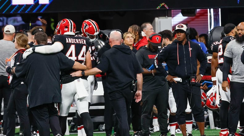 Falcons head coach Rahim Morris watches Falcons linebacker Troy Andersen (44) carried out of the field by Falcons medical staff during the second half of an NFL football game against the New Orleans Saints on Sunday, Sept. 29, at Mercedes-Benz Stadium in Atlanta.
(Miguel Martinez/ AJC)