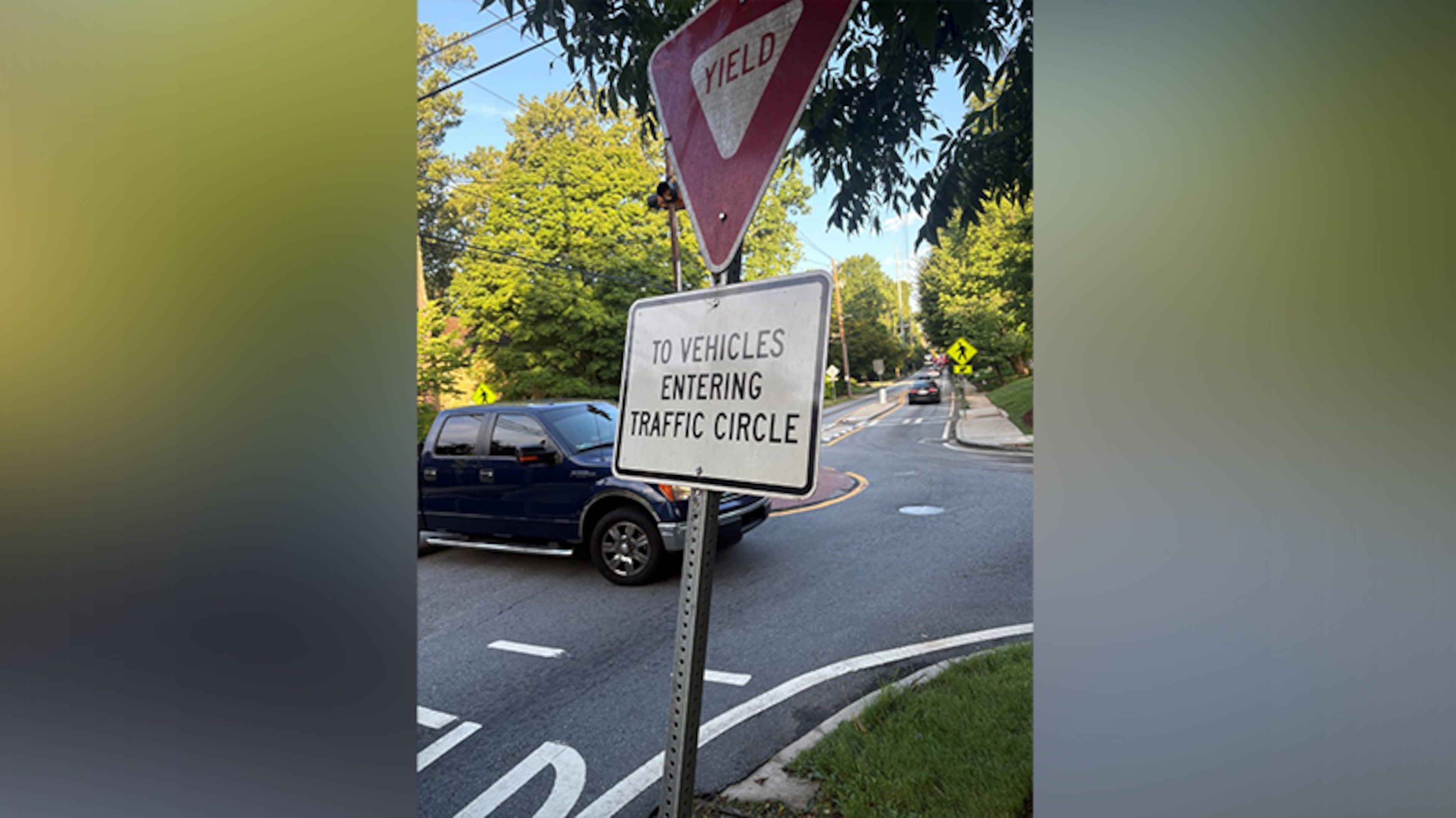 Druid Hills resident Don Jennings spotted signs in roundabouts on North Decatur Road at Oakdale and at Springdale that told drivers to violate Georgia law. DeKalb County ended up removing the signs. (Courtesy of Don Jennings)