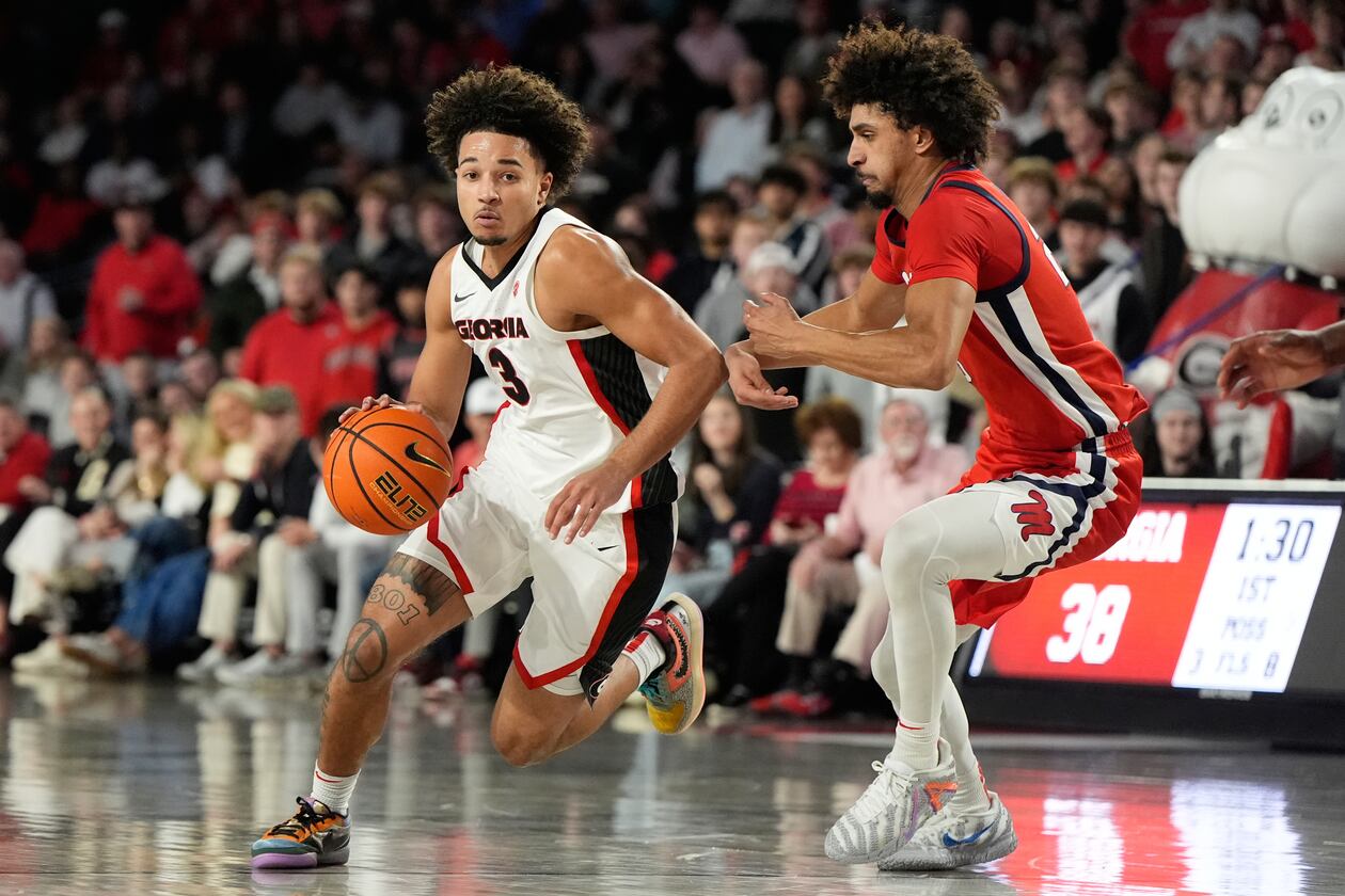 Georgia guard Jordan Ross dribbles the ball against Mississippi guard Patton Pinkins during an NCAA college basketball game, Wednesday, Jan. 14, 2026, in Athens, Ga. Pinkins scored the game-winner as Ole Miss knocked off No. 21 Georgia in overtime, 97-95. (Brynn Anderson/AP)