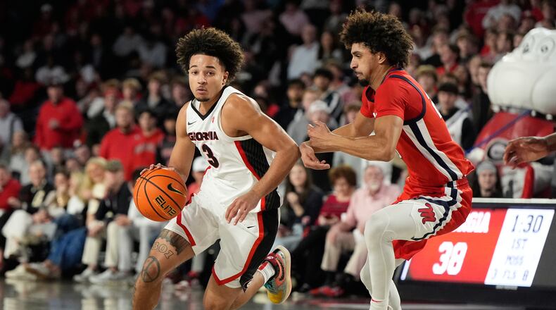Georgia guard Jordan Ross dribbles the ball against Mississippi guard Patton Pinkins during an NCAA college basketball game, Wednesday, Jan. 14, 2026, in Athens, Ga. Pinkins scored the game-winner as Ole Miss knocked off No. 21 Georgia in overtime, 97-95. (Brynn Anderson/AP)