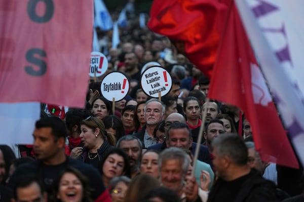 Several thousand Turkish Cypriots took to the streets of the northern half of ethnically divided Cyprus' capital Nicosia to protest what they say is Turkey's attempt to erode their secular roots and to strengthen the hold of political Islam over their society, on Friday, May 2, 2025. (AP Photo/Petros Karadjias)