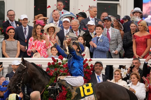 Jockey Junior Alvarado celebrates after riding Sovereignty to victory in the 151st running of the Kentucky Derby horse race at Churchill Downs Saturday, May 3, 2025, in Louisville, Ky. (AP Photo/Abbie Parr)