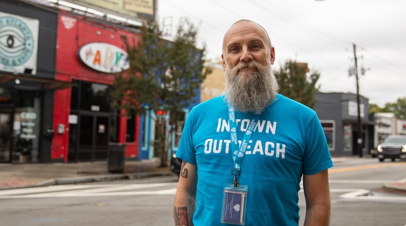 Michael Nolan, case manager for nonprofit Intown Cares, stands for a portrait in the heart of East Atlanta Village on Oct. 12, 2023. Nolan will be spearheading a new pilot program in the neighborhood to make connections with individuals experiencing homelessness and help get them housed. (Riley Bunch/riley.bunch@ajc.com)