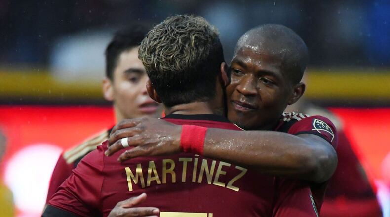 Atlanta United's Darlington Nagbe congratulates Josef Martinez after his goal in the second half of Saturday's friendly at First Tennessee Park in Nashville. (Christopher Hanewinckel-USA TODAY Sports)