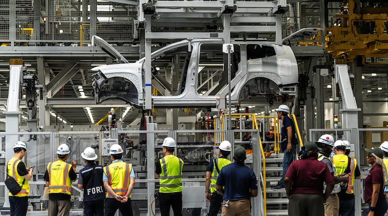 Hyundai Motor Group Metaplant America employees watch as a pre-production IONIQ 9 makes its way through General Assembly in Ellabell, Georgia, in November 2024. (Hyundai/TNS)