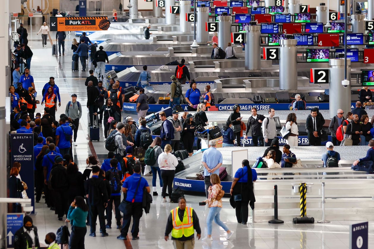 Travelers walk around the baggage claim in the South Terminal at Hartsfield-Jackson Atlanta International Airport on Thursday, Nov. 6, 2025. Atlanta is among the airports where the FAA will reduce flights due to the shutdown, and airports are facing a shortage of air traffic controllers.
(Miguel Martinez/ AJC)
